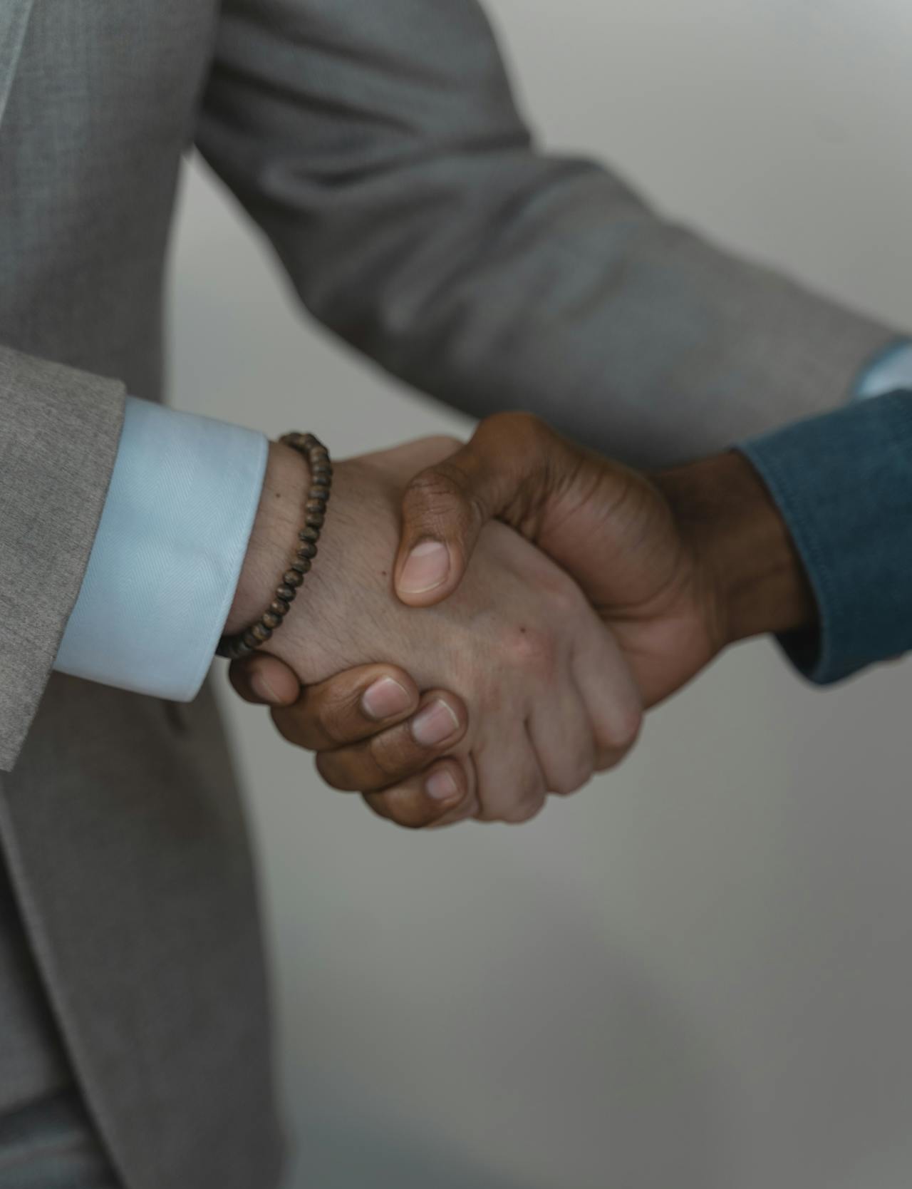 Handshake symbolizing trust, quality, and customer satisfaction in HVAC solutions and services.